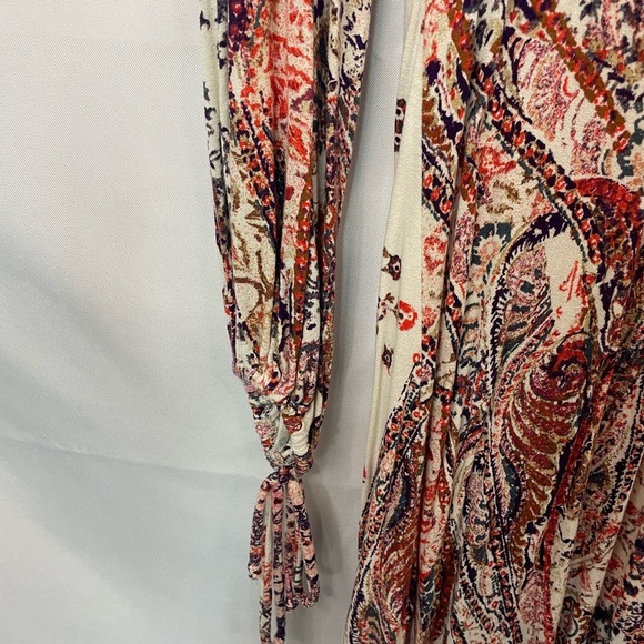 Boho and Gypsy style dress by Free People. Has an open back and elastic sleeves. - Picture 2 of 6